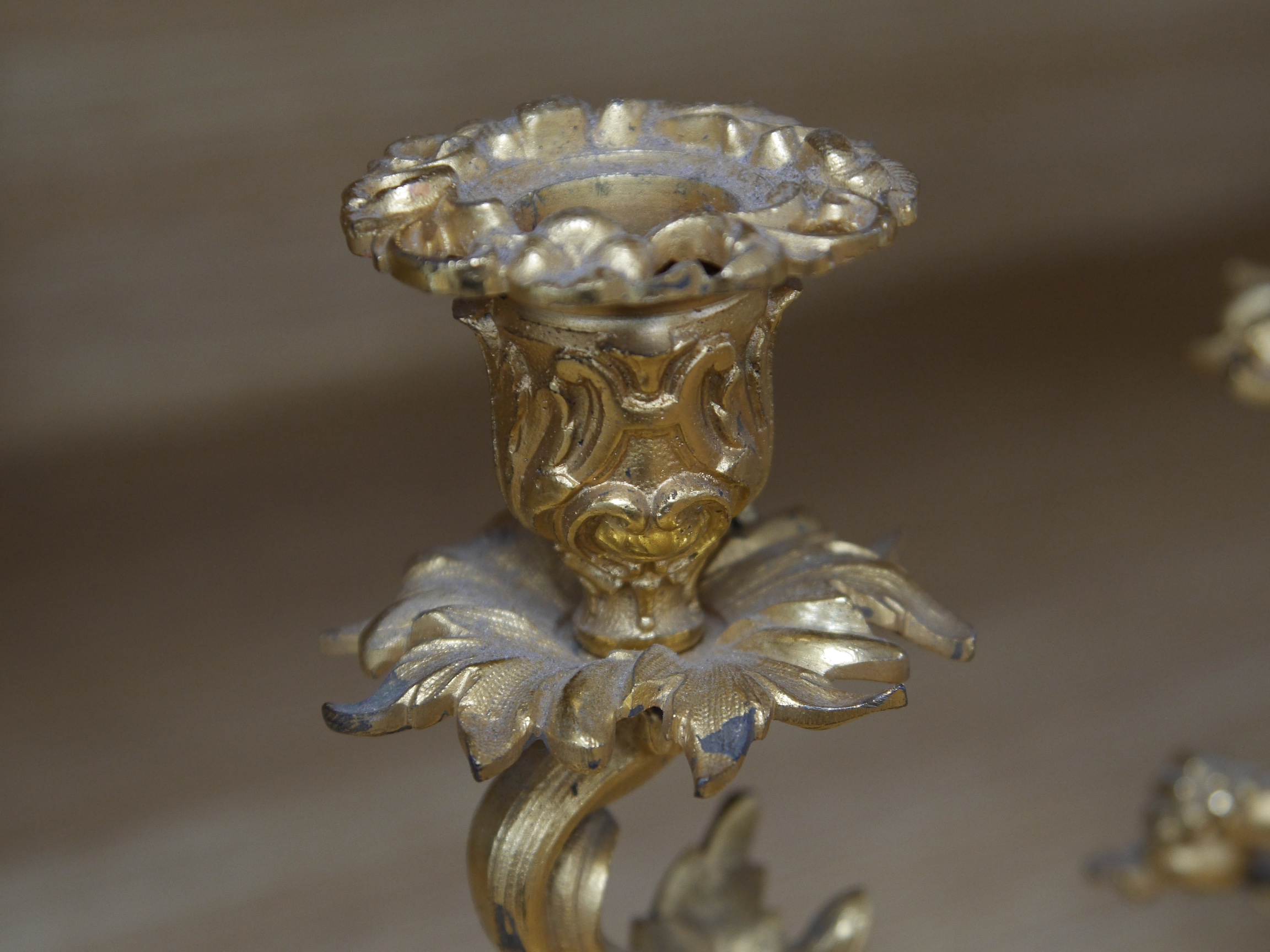 A pair of Louis XV-style ormolu candlesticks, 21cm high. Condition - slight tarnishing